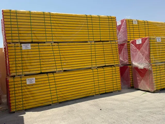 Wrapped and strapped packs of H20 timber beams with pack labels